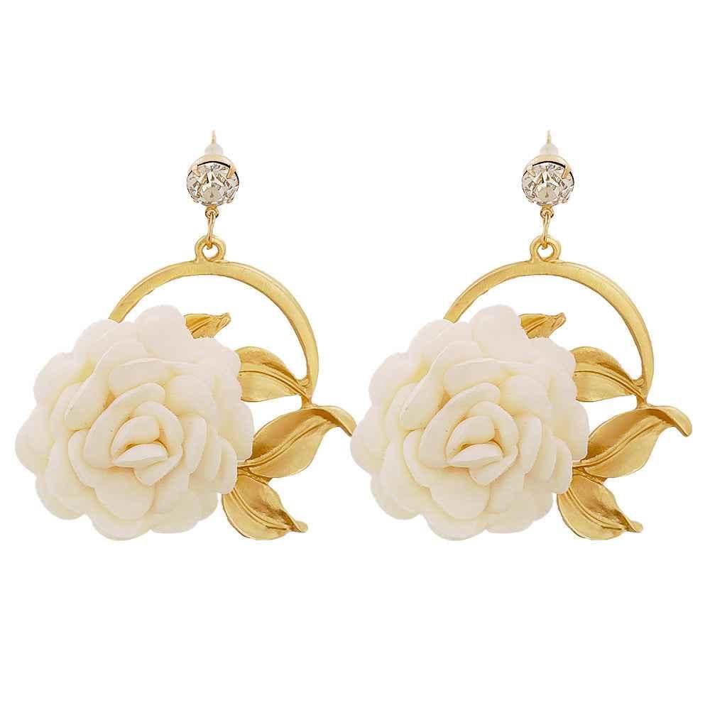 Elegant gold hoop earrings with white rose flower and crystal stud accents
