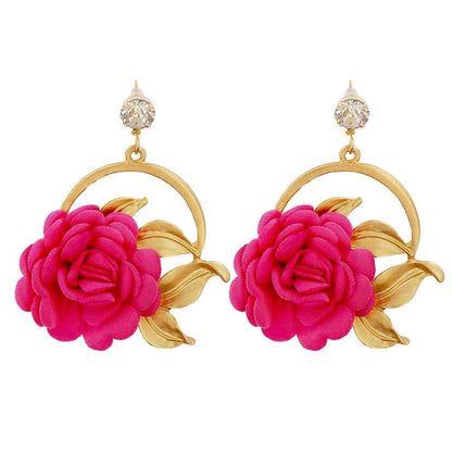 Pair of gold-tone earrings with pink fabric rose flowers and leaf design, clear stone studs
